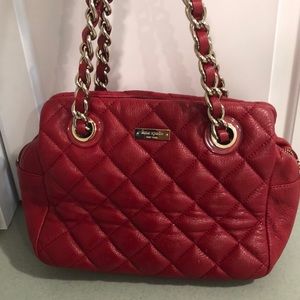 Like new-Kate Spade classic red quilted handbag with chain strap.